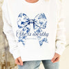 Explore More Collection -She Is Worthy Blue Bow Graphic Tee