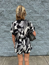 Rena - A Roll Up Sleeve Button Down Abstract Print Romper