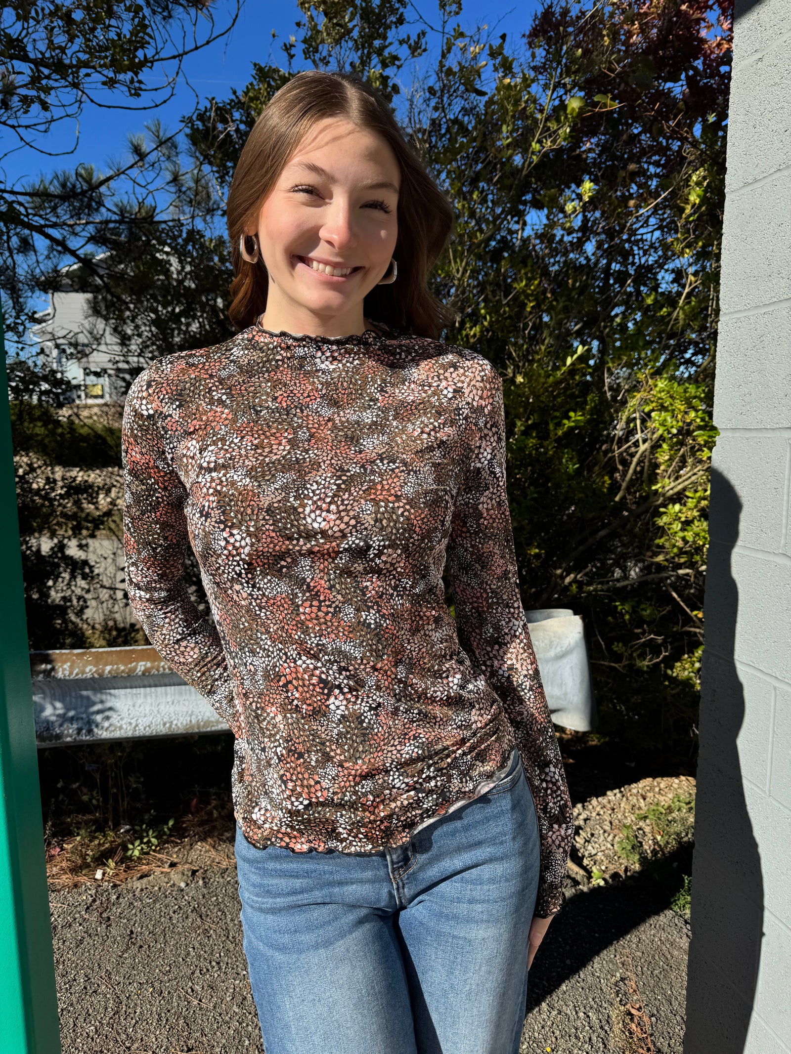 Tommy - A Long Sleeve Mock Neck Floral Print Top with Frilled Merrow Hem