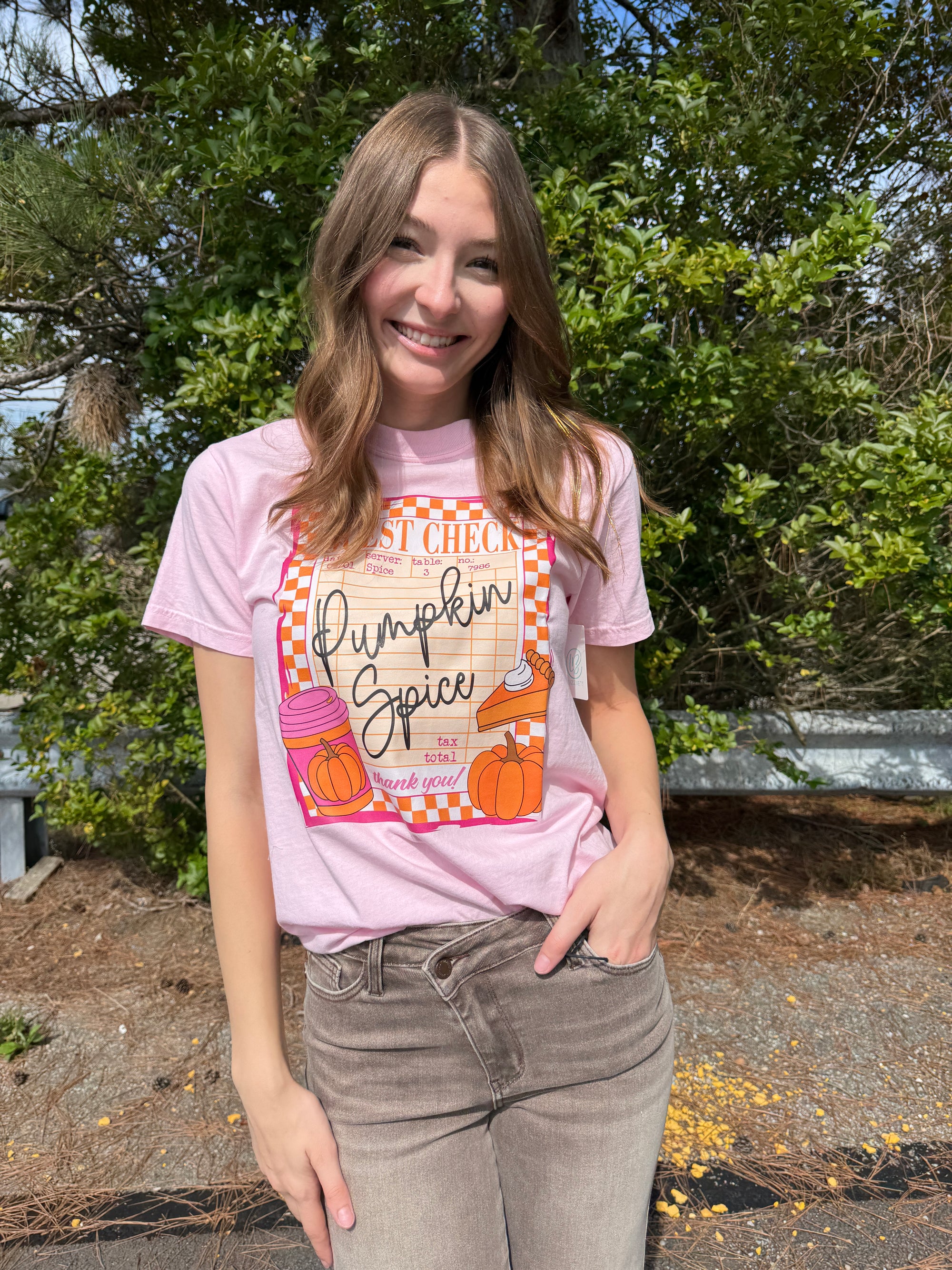 Female wearing a Guest Check Pumpkin Spice Graphic Tee shirt from Lizzie's Boutique