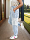 Explore More Collection - Crochet Pocketed Distressed Drawstring Jeans