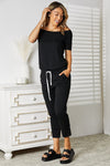 Explore More Collection - Double Take Asymmetrical Neck Tied Jumpsuit with Pockets