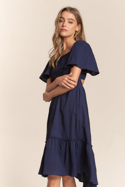 Explore More Collection - J.NNA Smocked Bow Back Ruffle Hem Dress